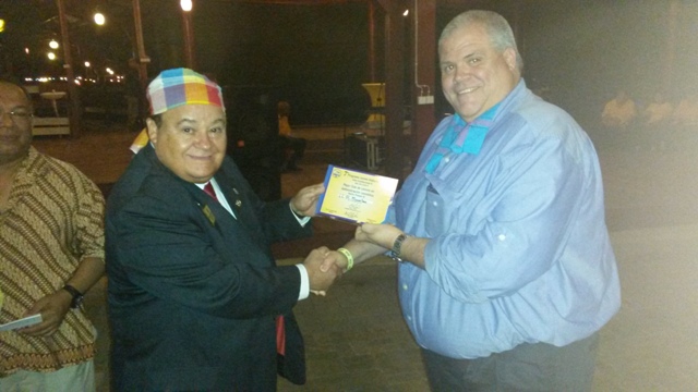 The St. Maarten Lions Club President Lion Claudio Buncamper receives the award of Club of the Year for the FOLAC constitutional area a first in over 20 plus years from the FOLAC representative Past International Director Lion Carlos 