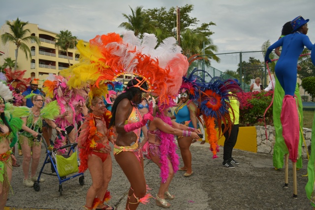 A carnival troupe parades through Simpson Bay Resort. Janice Young, dubbed the carnival queen, is pictured amongst revelers (second from left, with walker). 