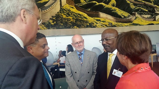 Caption: PM W Marlin in conversation w Curacao PM, Dutch delegation